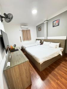 Giường trong phòng chung tại A25 Hotel - 19 Bùi Thị Xuân