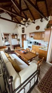 a living room with a couch and a table at Orechova - orech+ova in Arachova