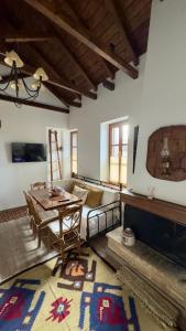 a living room with a table and a couch at Orechova - orech+ova in Arachova +26 photos