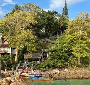 a resort on a hill next to the water at HIP Seaview Resort @ Phi Phi in Phi Phi Islands