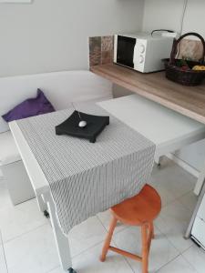 a white table with a computer mouse on top of it at Sea and Stars House in Svoronata