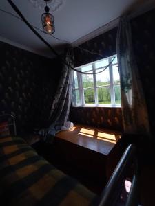 Rúm í herbergi á Iamze's Guest House