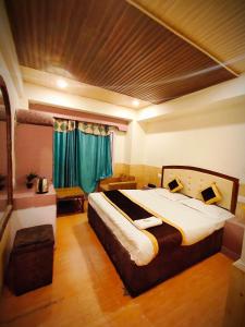 Voodi või voodid majutusasutuse Hotel Shorya toas