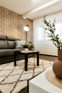 a living room with a couch and a coffee table at Apartamento Palacio de Justicia in Logroño