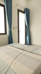 Ένα ή περισσότερα κρεβάτια σε δωμάτιο στο Homestay Khải Minh