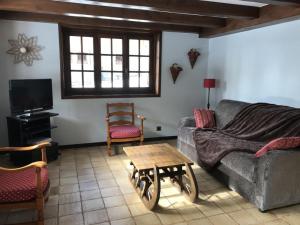 a living room with a couch and a coffee table at Grangettes in Les Carroz d'Araches