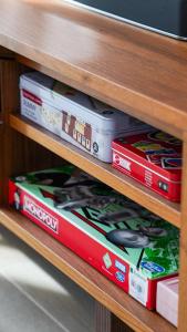 a stack of pizza boxes sitting on a shelf at Canal view 3 bedroom holiday home with balcony in Abu Dhabi