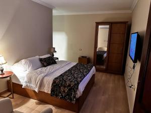 A bed or beds in a room at Rentrific