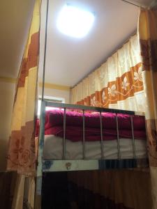 a bunk bed in a room with a window at New Nhat Minh HomeStay in Ninh Binh