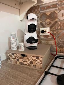 a coffee machine sitting on a counter in a kitchen at DONNA FELICIA in Pachino
