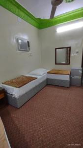 En eller flere senger på et rom på DAR MOHAMMED HOTEL دار محمد فندق
