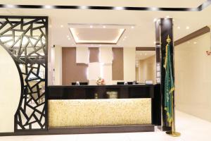 a lobby with a large mirror and a flag at رمز الفخامة in Taif