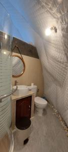 a bathroom with a toilet and a sink at นรดีฮิวล์ รีสอร์ต เขาแผงม้า วังน้ำเขียว in Ban Sap Bon