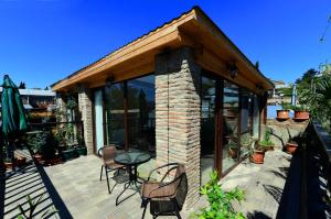 a house with a patio with a table and chairs at Apart10 "Capture Old Tbilisi Spirit" in Tbilisi City