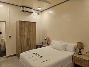 En eller flere senge i et værelse på Island Luxury Fehendhoo