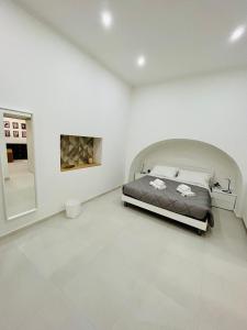 Postel nebo postele na pokoji v ubytování Boiardo Art House