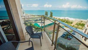 a balcony with a view of the ocean at Batumi Royal Apartments in Batumi