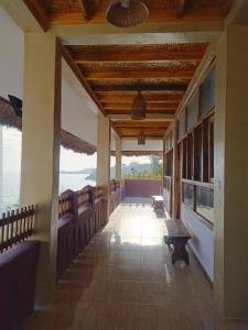 a hallway of a resort with a view of the ocean at Villa Redemptorist in Weetebula