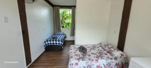 Ein Bett oder Betten in einem Zimmer der Unterkunft Pousada na Montanha em Trindade RJ - Tia Tutuca Olhar Indígena