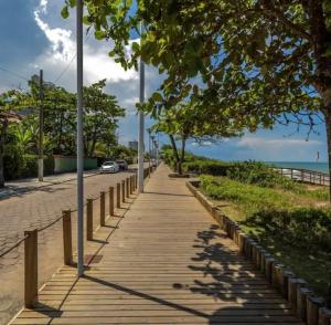 a sidewalk with poles on the side of a street at Sobrado em Piçarras com piscina in Piçarras