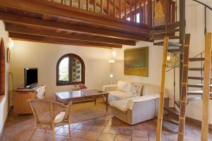 a living room with a loft bed and a couch at Finca Los Dioses I in Mogán