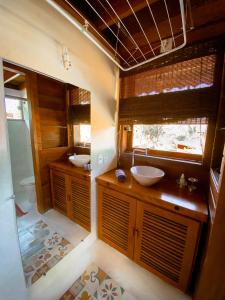 a bathroom with a sink and a toilet at CASA Ecológica Paraty in Paraty