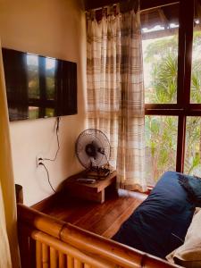TV a/nebo společenská místnost v ubytování CASA Ecológica Paraty