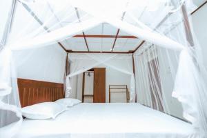 Krevet ili kreveti u jedinici u okviru objekta Sripali villa