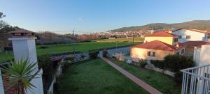 a view from the balcony of a house with a yard at Torre de Santiago - Guest House in Vila Praia de Âncora