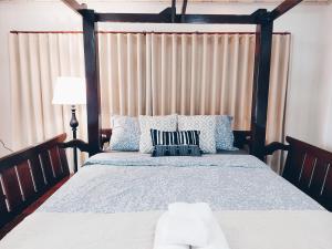 Postel nebo postele na pokoji v ubytování Green Riverside Homestay