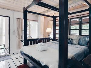 Ένα ή περισσότερα κρεβάτια σε δωμάτιο στο Green Riverside Homestay