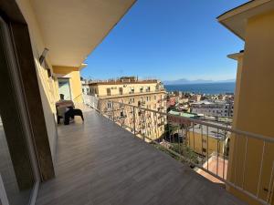 a balcony with a view of a city at Casa Langellotti plus in Naples