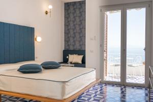 מיטה או מיטות בחדר ב-Amalfi Gioia House