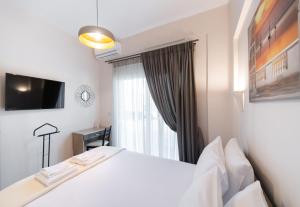 Postel nebo postele na pokoji v ubytování Ruellia Luxury Apartments