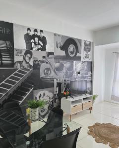 a living room with a mural of a car on the wall at Departamento Moritan in Posadas