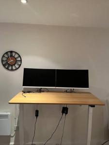 a computer monitor sitting on top of a desk at 1 Bed flat in Central London in London
