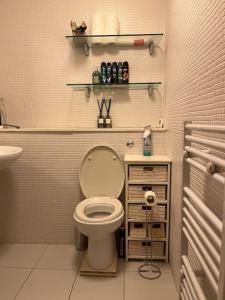 a bathroom with a toilet and a sink at 1 Bed flat in Central London in London