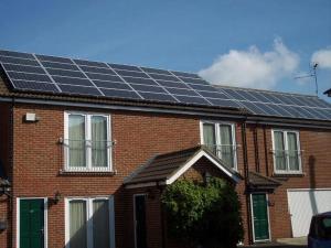 a brick house with solar panels on the roof at Oliver Cromwell Hotel in March