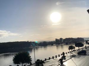 a view of a river with the sun in the sky at Luz de Mar in O Grove