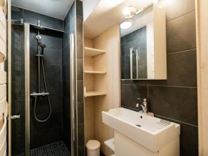 a small bathroom with a sink and a shower at Bel Appartement 3 Pièces avec Balcon, Proche Centre Châtel, Parking et Connexion WiFi - FR-1-676-119 in Châtel