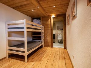 a room with a bunk bed and a bathroom at Bel Appartement 3 Pièces avec Balcon, Proche Centre Châtel, Parking et Connexion WiFi - FR-1-676-119 in Châtel