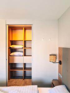 a bedroom with a bunk bed and a closet at Rêve d'été - Camping Belle-Vue 2000 in Berdorf +3 photos