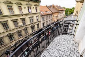 a view from a balcony of a city with buildings at Modern 3 Bedrooms Apartment in Budapest