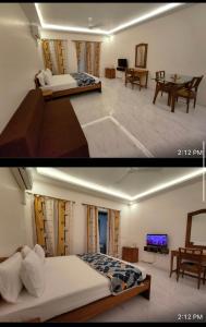 a bedroom and a living room with a bed and a table at Riveria Foothills & Residency Apartments in Baga
