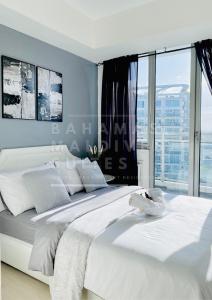 Katil atau katil-katil dalam bilik di The Bahamas and Maldives Suites at Azure Residences near Manila Airport