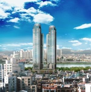 a city with three tall buildings and a river at Zenith residence in Ulsan