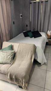 A bed or beds in a room at Recanto dos pássaros