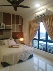 a bedroom with a bed and a large window at Adore Homestay@Emira Seksyen 13 Shah Alam, MSU, Stadium, AEON Mall in Shah Alam