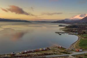 an aerial view of a large body of water at Nybygget arkitekt tegnet Snøhetta i vakker natur in Sand +38 photos