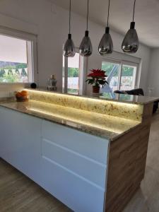 a kitchen with a large island with a counter top at Finca Vista El Montanes in Málaga